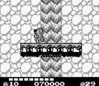 une photo d'Ã©cran de Adventure Island 2 - Aliens in Paradise sur Nintendo Game Boy